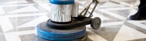 close up of floor stripping hand operated machine on marble floor