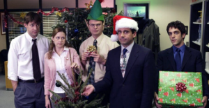 The show The Office with 3 actors with christmas and elf hats
